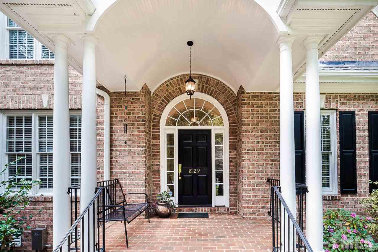 beautiful entry with porch to enjoy lovely landscaping