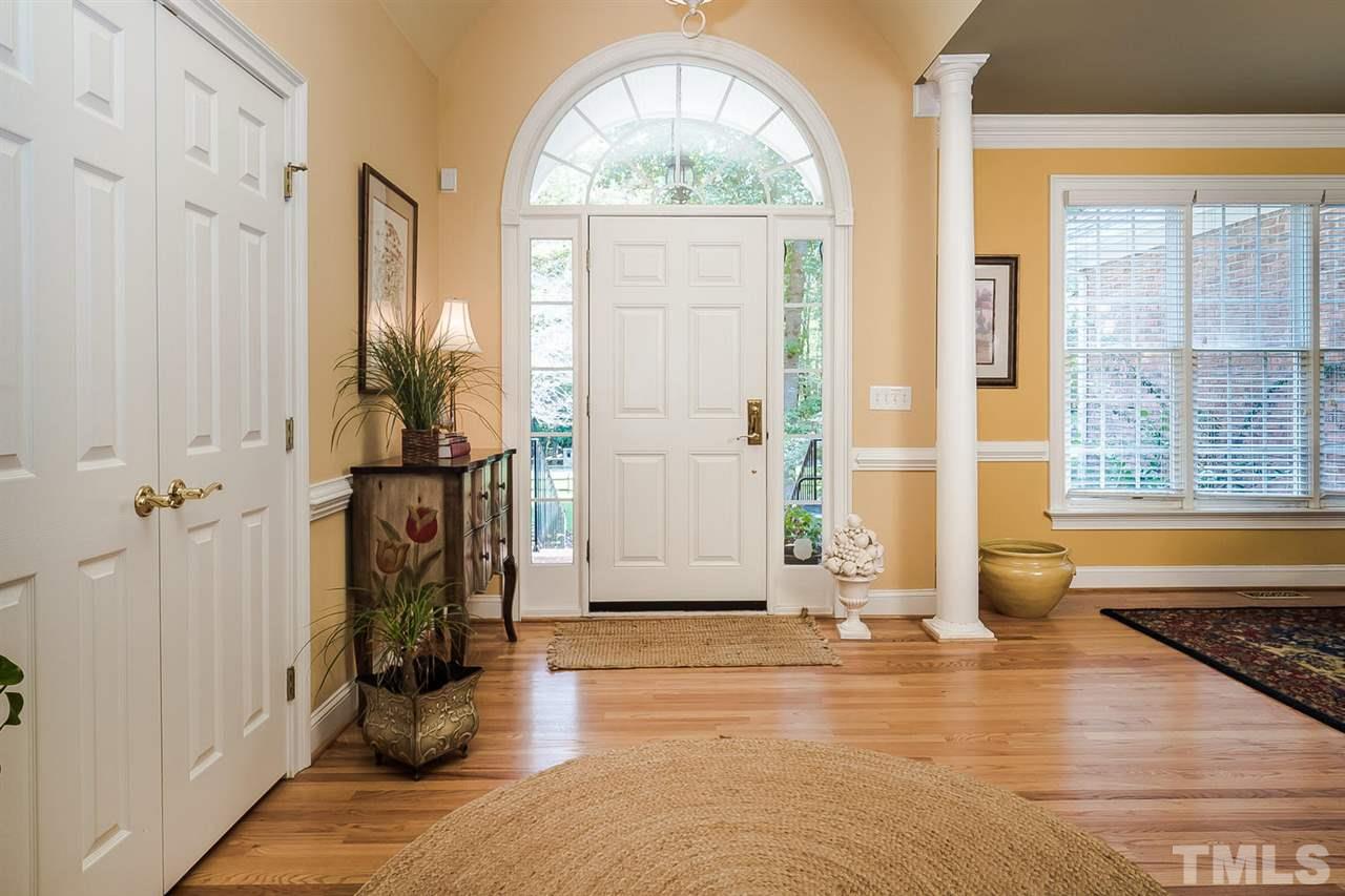 open foyer with wood floors