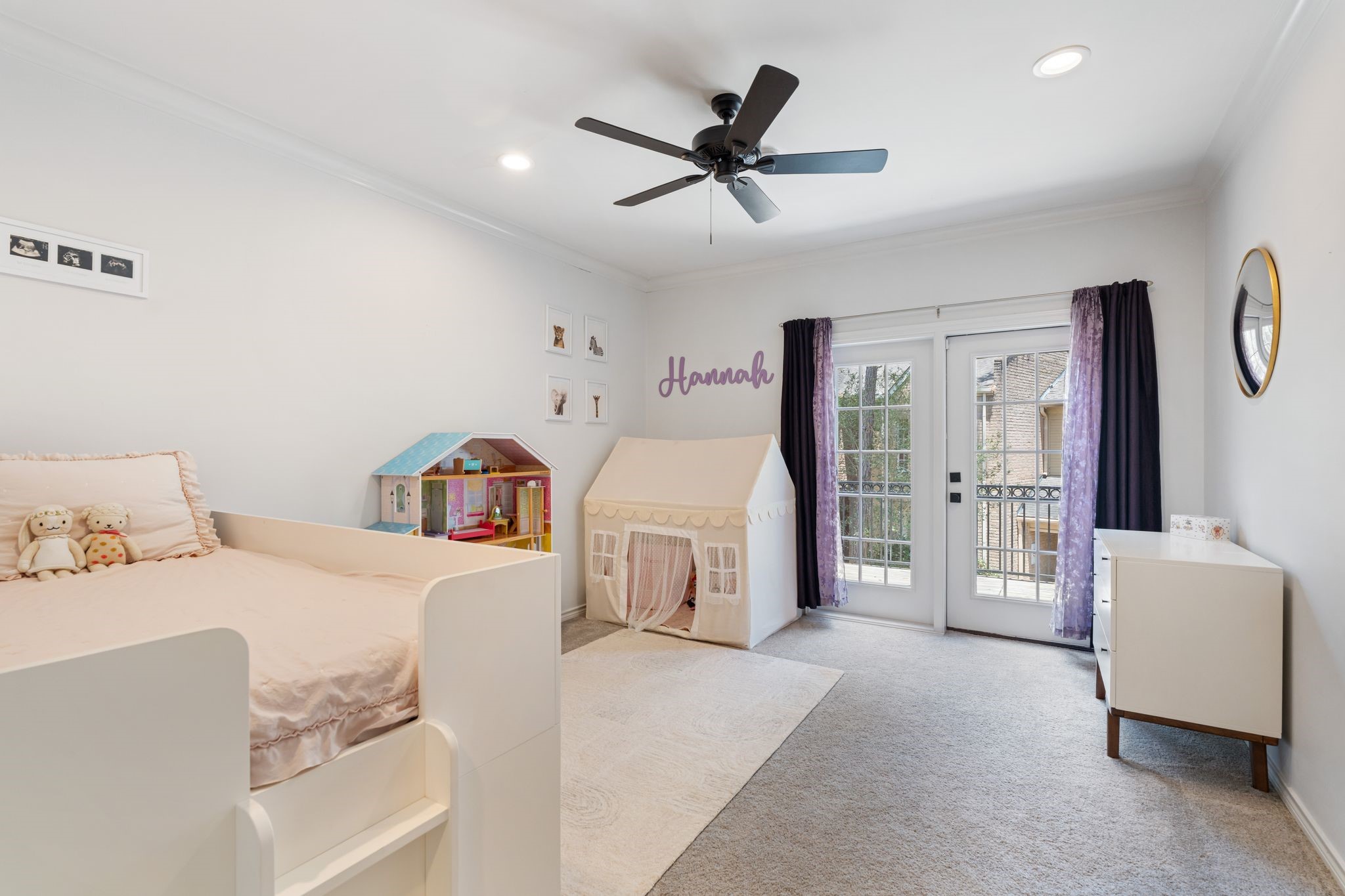 201 Vanderpool Lane, Unit 137 Houston, TX 77024 - Photo 26 of 42 Located on the 2nd floor alongside the primary suite, this spacious secondary bedroom #1 features windowed French doors leading to a large private balcony access, creating a bright and airy feel. Plush carpet flooring (with vinyl hardwoods underneath), drapes, recessed lighting, crown molding, and a ceiling fan add warmth and comfort throughout. The room also offers a large walk-in closet with built-in shelving and direct en-suite bathroom access for added convenience and privacy.