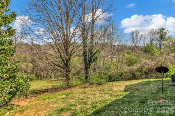 a view of a yard with an trees
