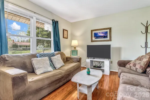 a living room with furniture and a flat screen tv