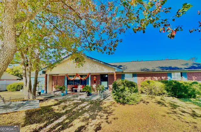a front view of a house with garden