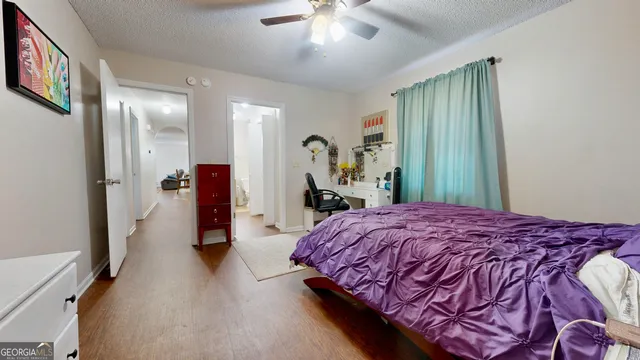 a bed room with a bed and a chandelier