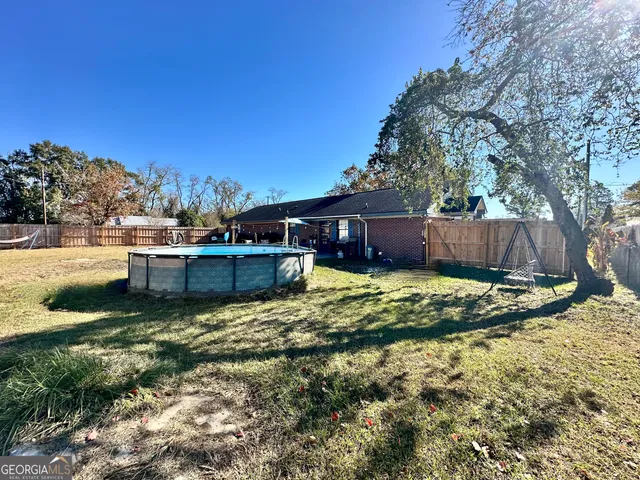 a house view with a backyard space