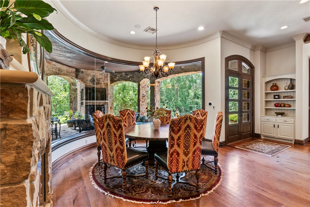3323 Emory Oak Drive Bryan, TX 77807 - Photo 10 of 50 Dining Area with Fireplace and Curved Glass
