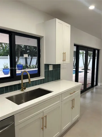 a bathroom with a toilet a sink and shower