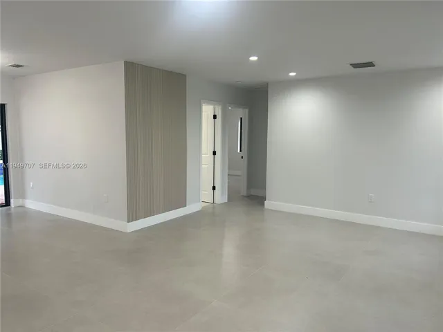 a kitchen with a stove and a cabinets