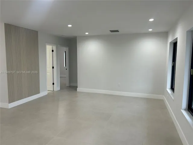 a kitchen with cabinets a sink and appliances
