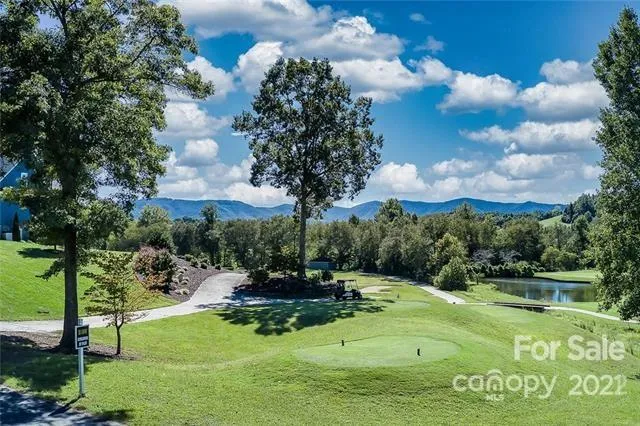 a view of a golf course with a fountain