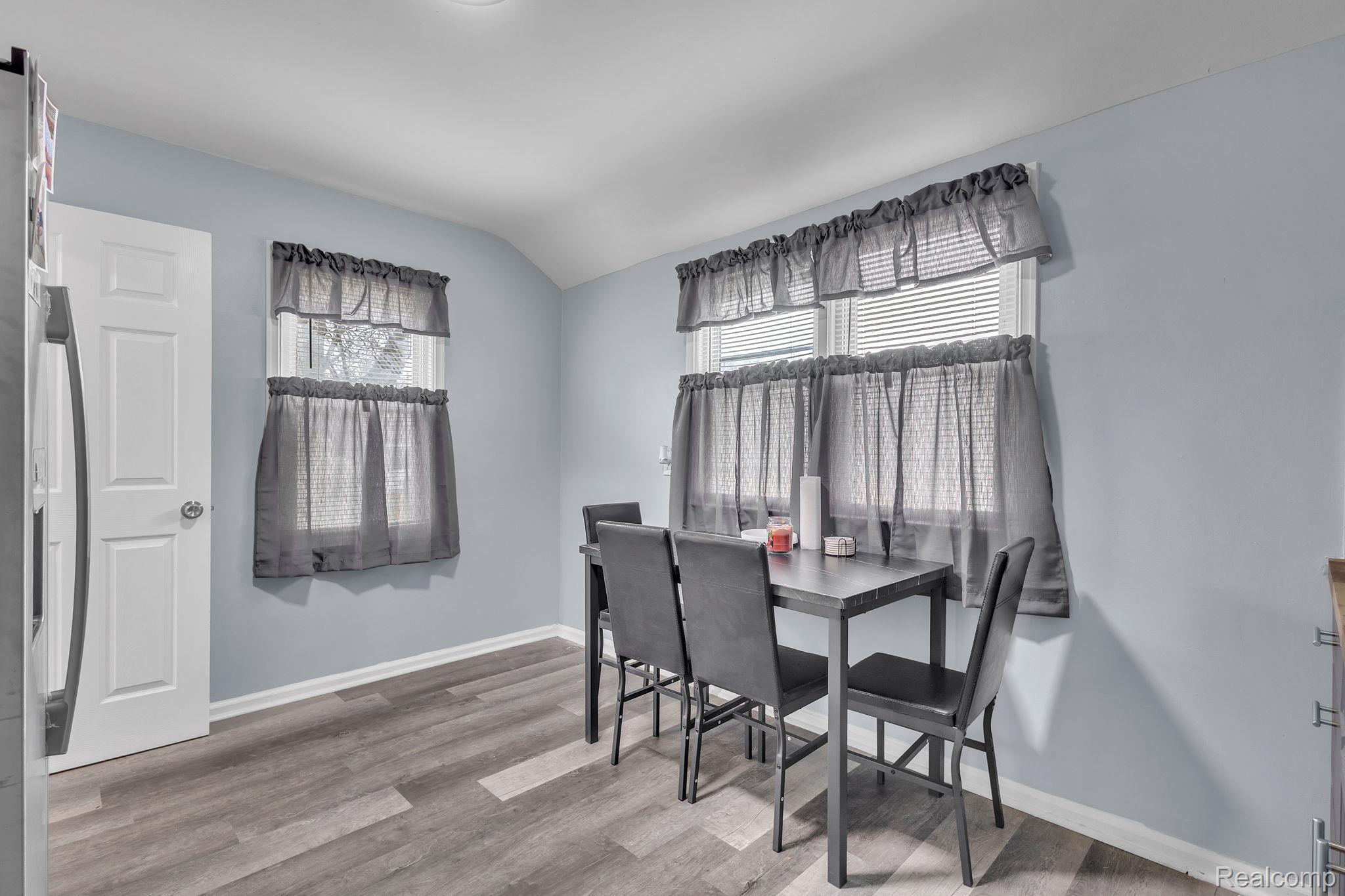 8401 Fielding Street Detroit, MI 48228 - Photo 7 of 34 Dining room with vaulted ceiling and light wood-style floors