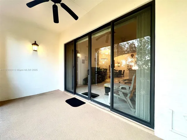 a view of an empty room and floor to ceiling window