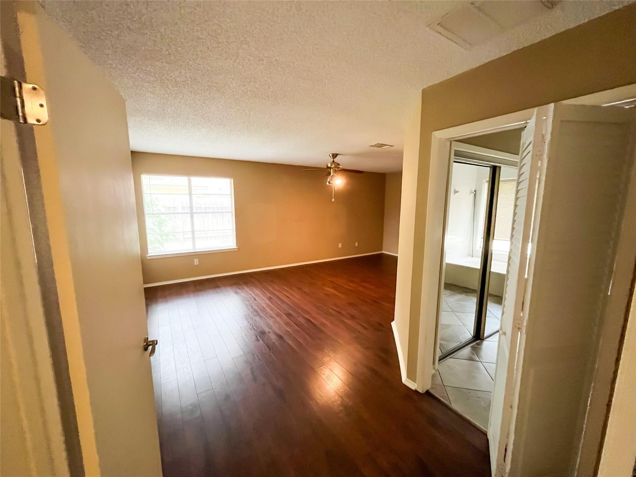 25531 Chapel Ridge Lane Spring, TX 77373 - Photo 12 of 14 a view of empty room with wooden floor and fan