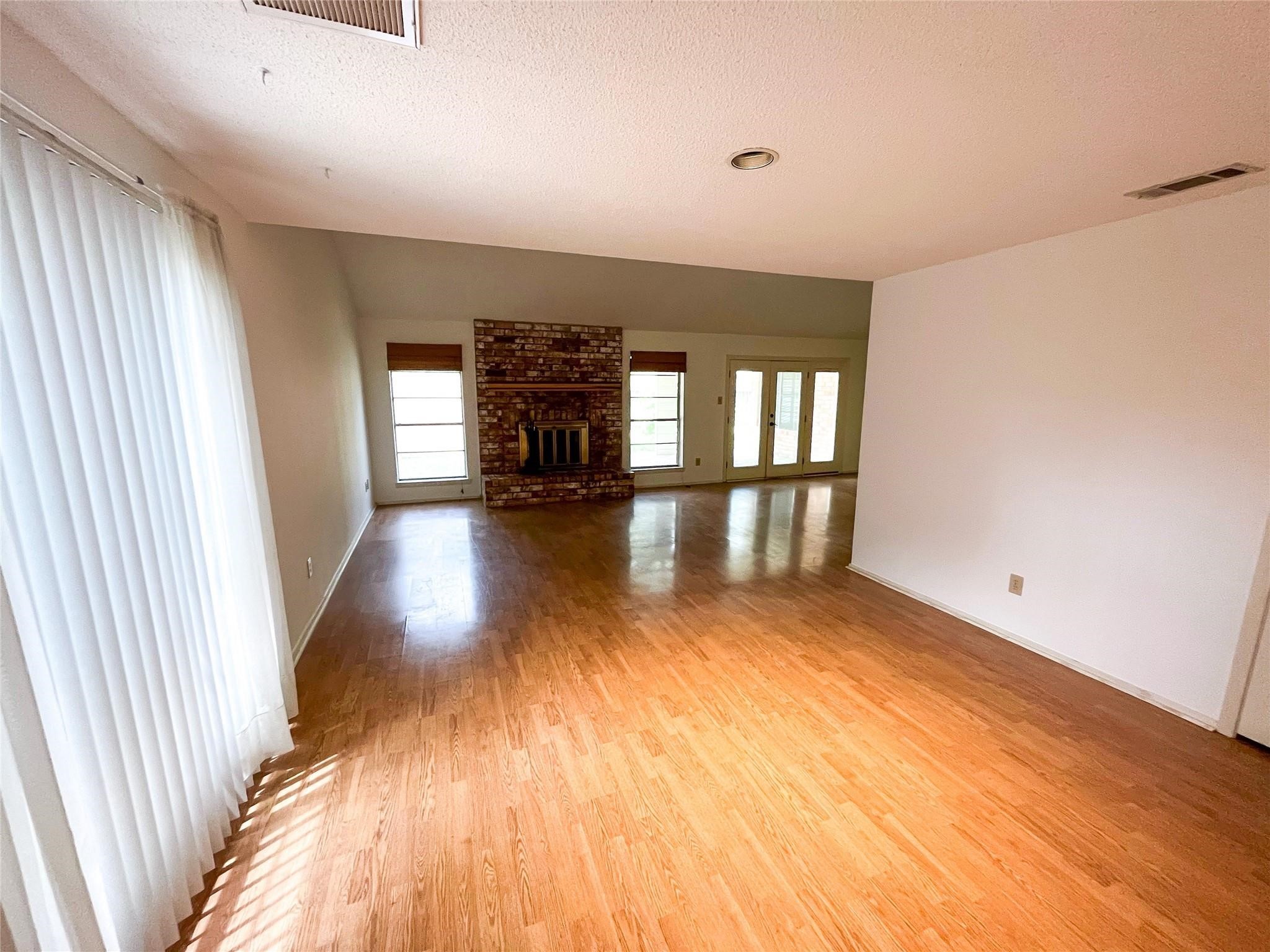 25531 Chapel Ridge Lane Spring, TX 77373 - Photo 13 of 14 wooden floor in an empty room with a window