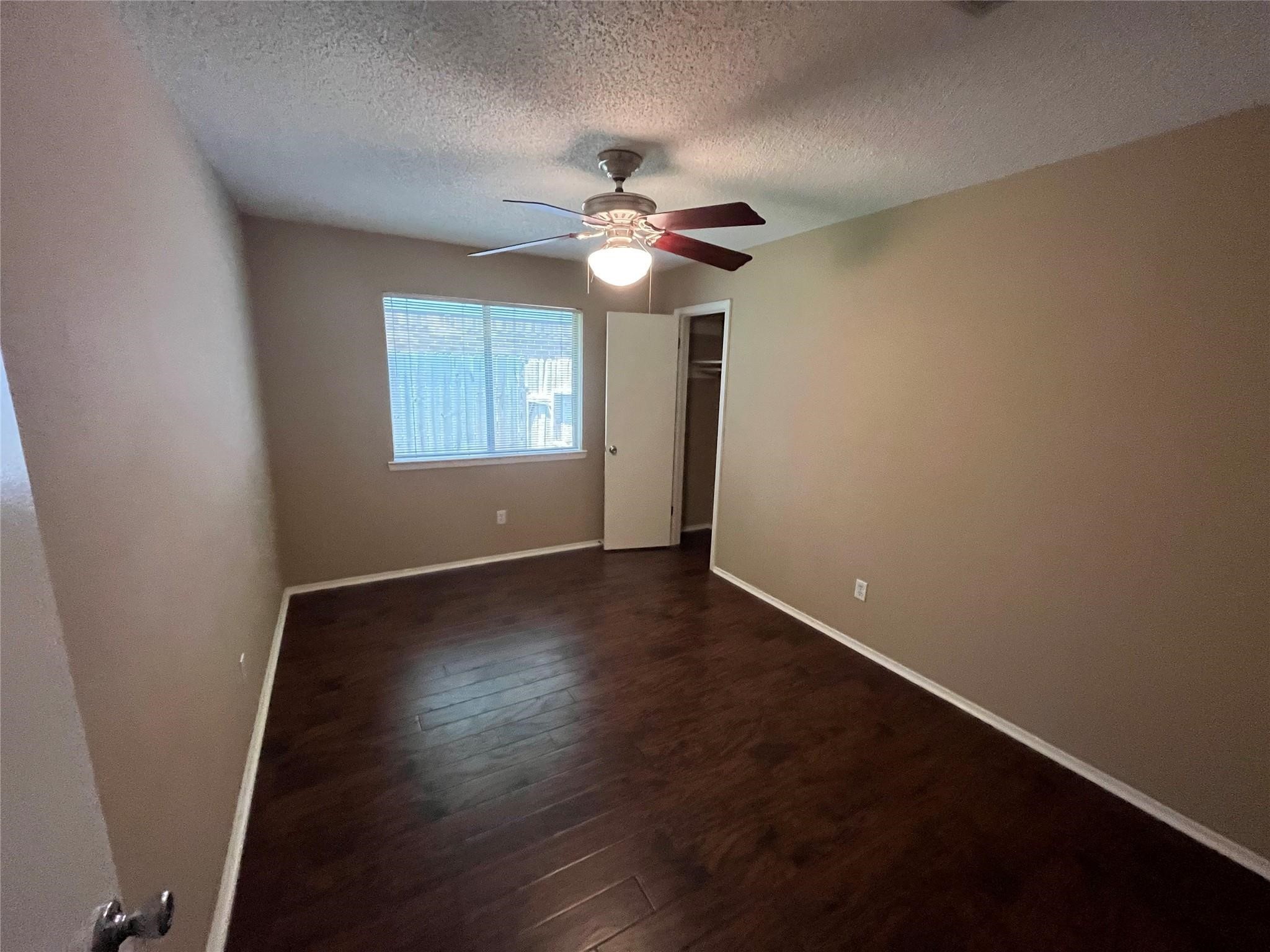 25531 Chapel Ridge Lane Spring, TX 77373 - Photo 8 of 14 a view of an empty room with wooden floor and a window