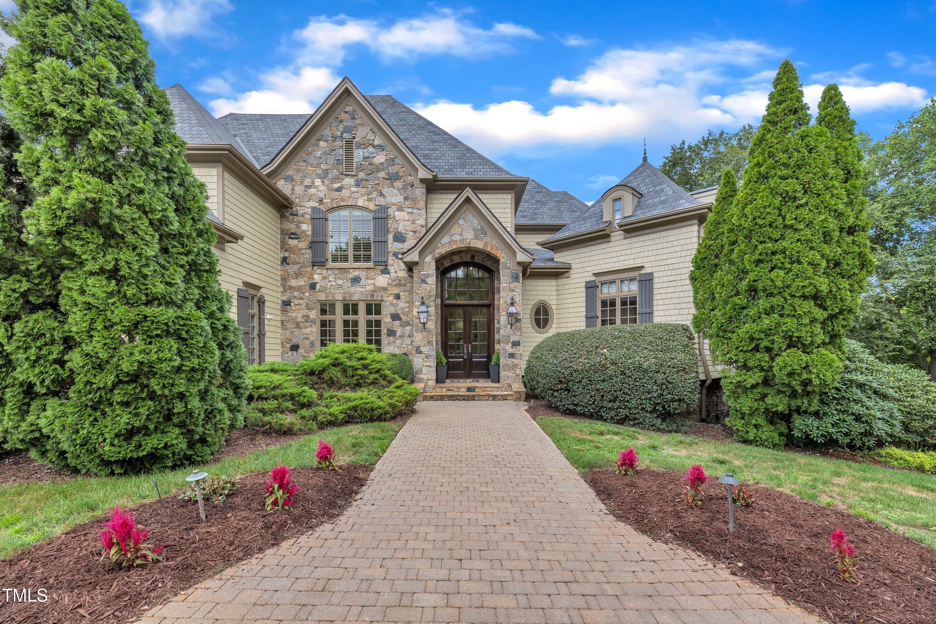 1112 Stone Kirk Drive Raleigh, NC 27614 - Photo 3 of 100 a front view of a house with a yard and potted plants