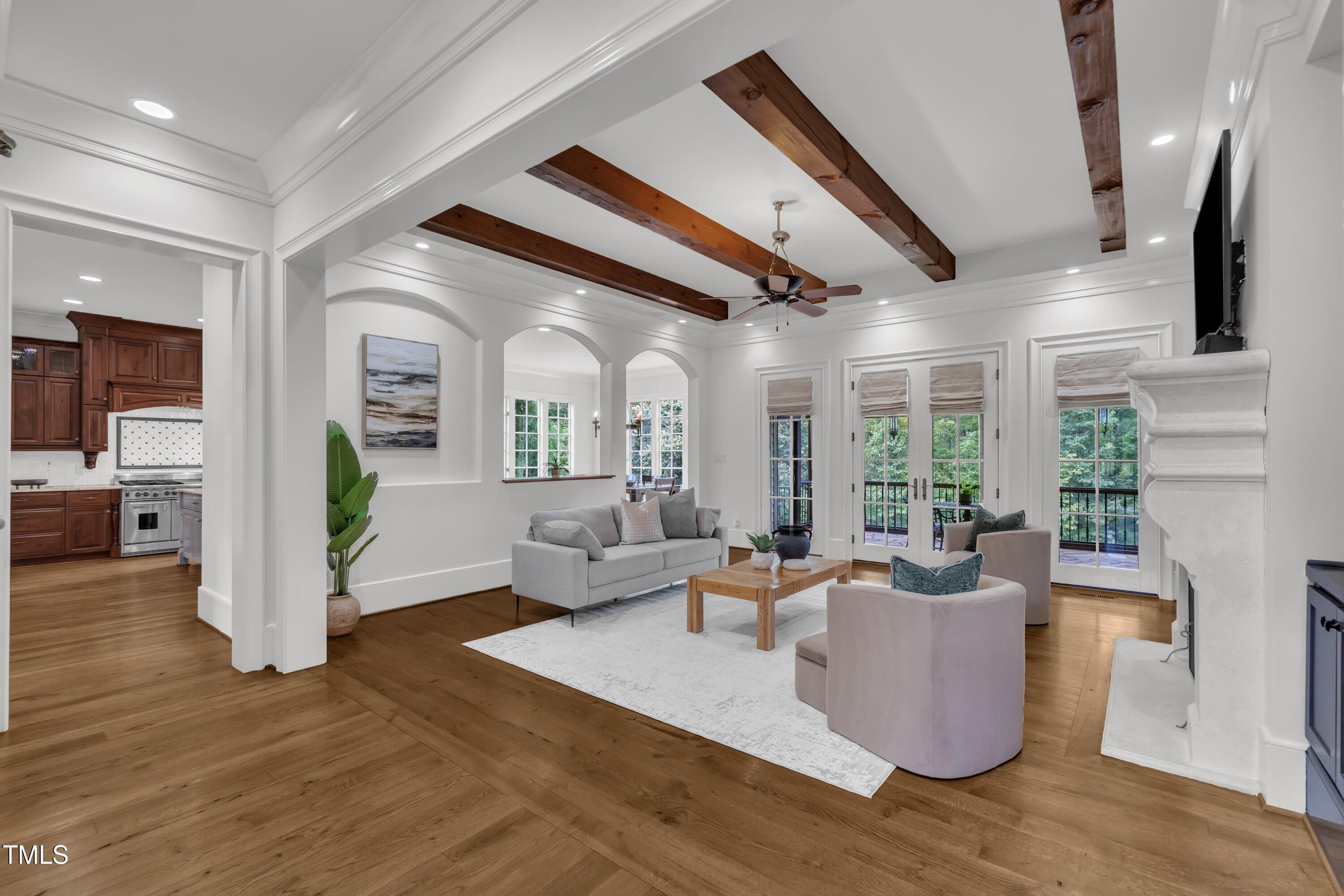 1112 Stone Kirk Drive Raleigh, NC 27614 - Photo 46 of 100 a living room with fireplace furniture and a large window