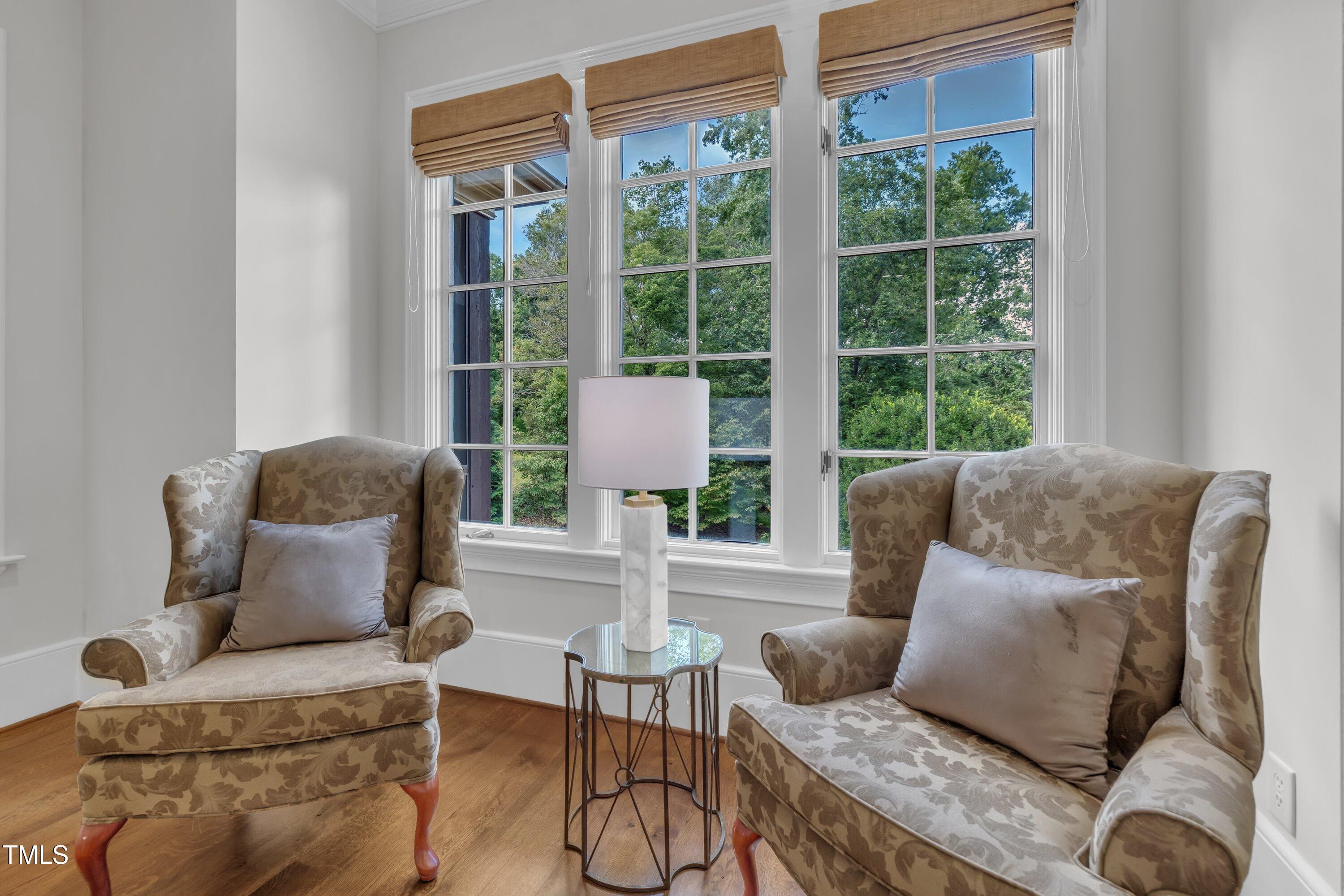 1112 Stone Kirk Drive Raleigh, NC 27614 - Photo 50 of 100 a living room with furniture and a large window