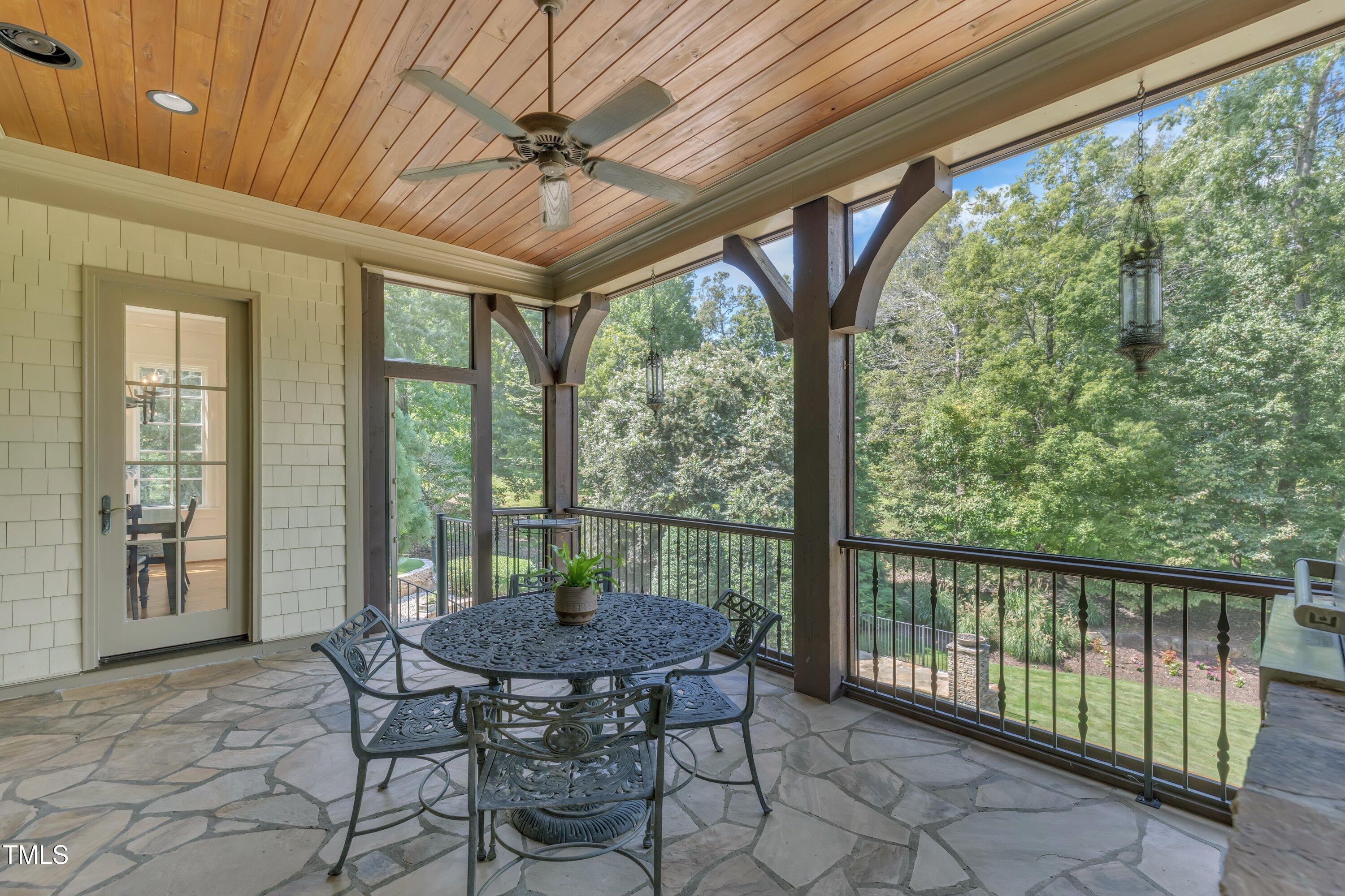 1112 Stone Kirk Drive Raleigh, NC 27614 - Photo 99 of 100 a view of a patio with a tv