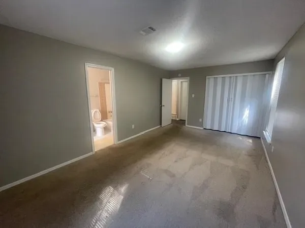 a view of hallway with wooden floor