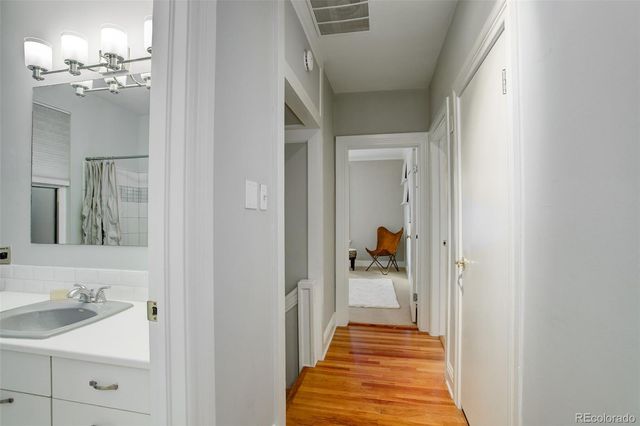a view of a bathroom from a hallway