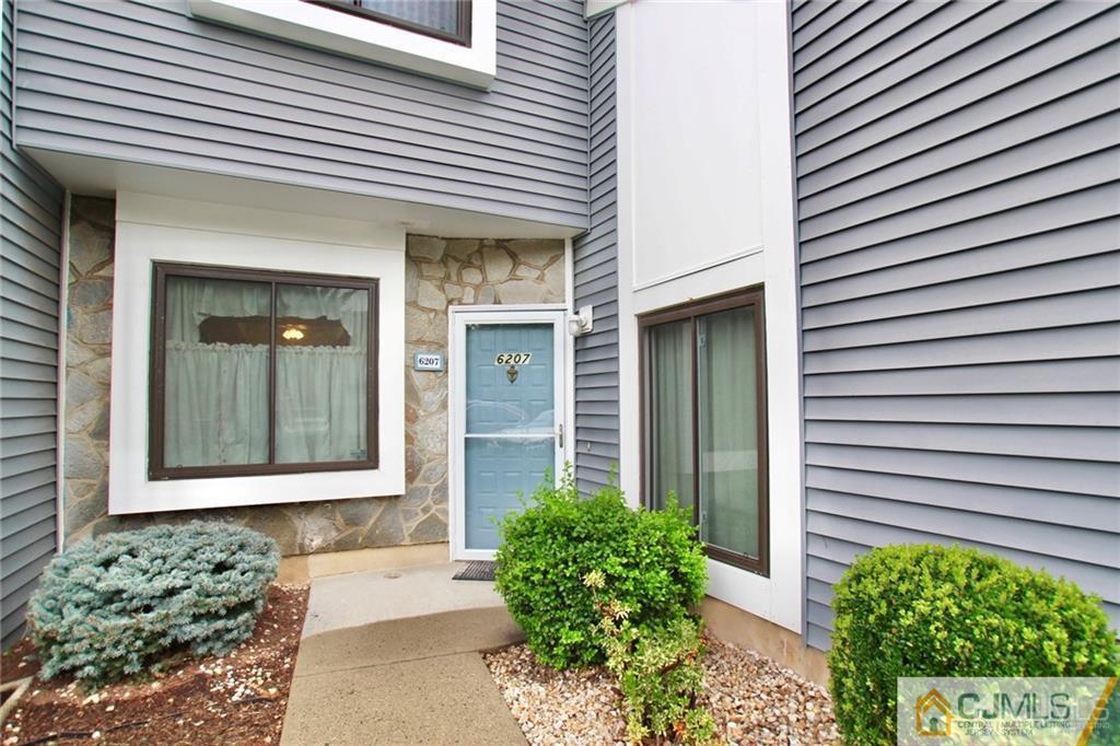 6207 Hana Road Edison, NJ 08817 - Photo 3 of 24 a front view of a house with a yard