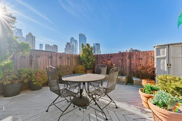 a view of a patio with furniture and a potted plants