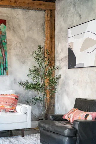 a bedroom with a bed and a couch