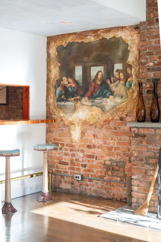 a view of a living room with a wooden floor
