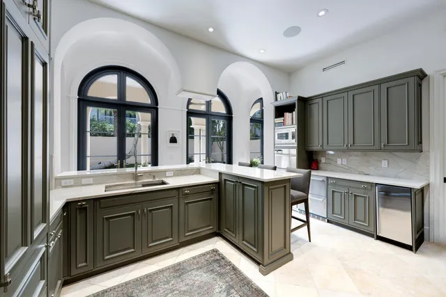 a kitchen with a sink and cabinets