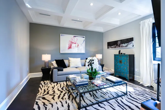 a spacious bedroom with a bed and glass door