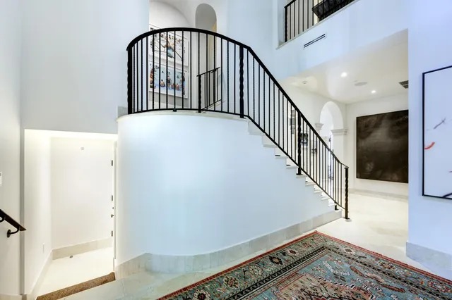 a view of staircase with rug floor