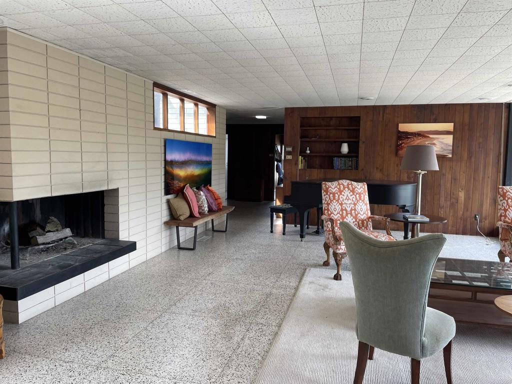 1234 Oribia Road Del Mar, CA 92014 - Photo 6 of 22 a living room with furniture a fireplace and a flat screen tv