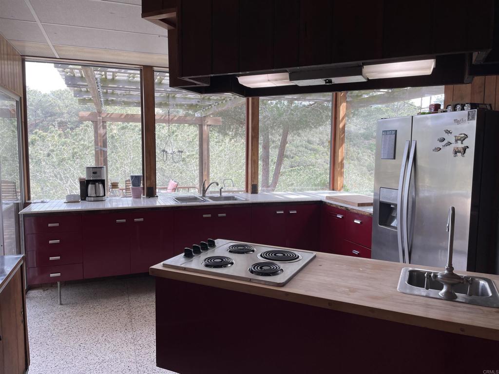 1234 Oribia Road Del Mar, CA 92014 - Photo 7 of 22 a kitchen with a stove and a refrigerator