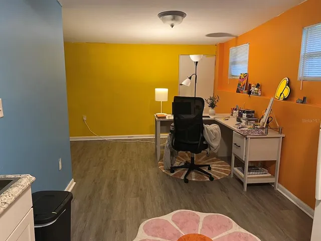 a room with a bed and cabinets