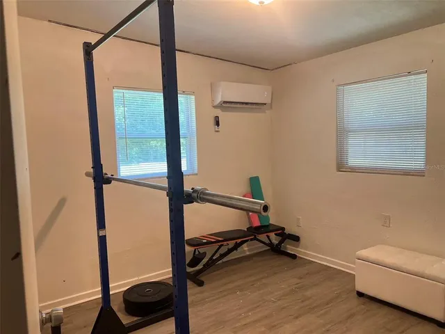 a view of a house with backyard and a garden