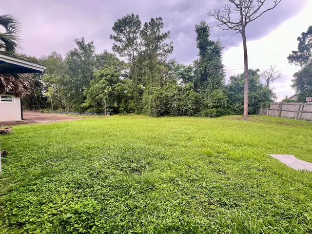 a view of a house with a big yard
