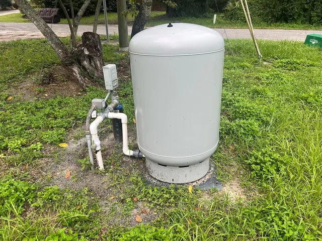 a backyard of a house with outdoor seating