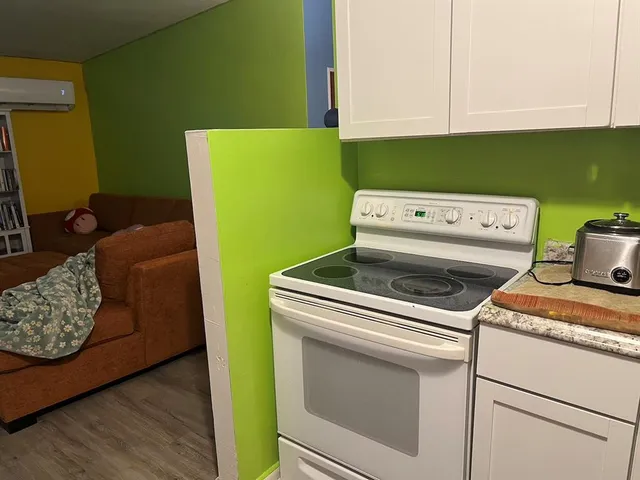 a kitchen that has a stove and a refrigerator