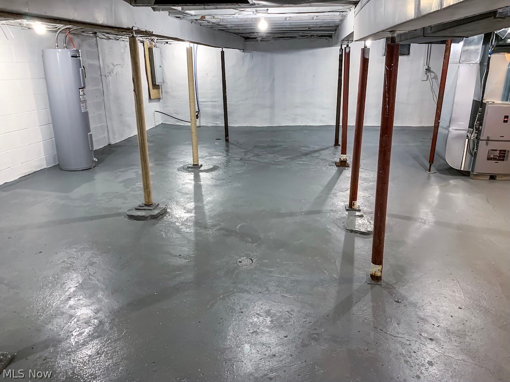 6844 Henderson Road Ravenna, OH 44266 - Photo 19 of 24 Freshly painted basement with New Hot Water Tank, New Electrical Panel, New Sump Pump, and New Furnace