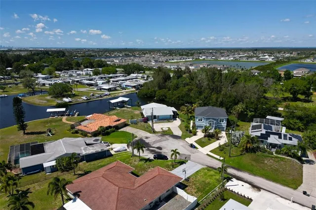 an aerial view of a house with pool yard and outdoor seating