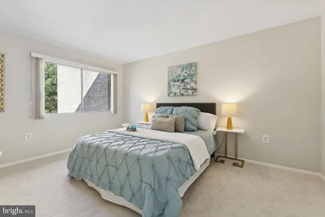 a dining room with furniture and a window