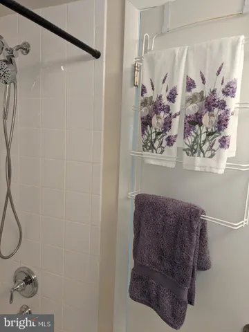 a bathroom with a sink mirror and a toilet