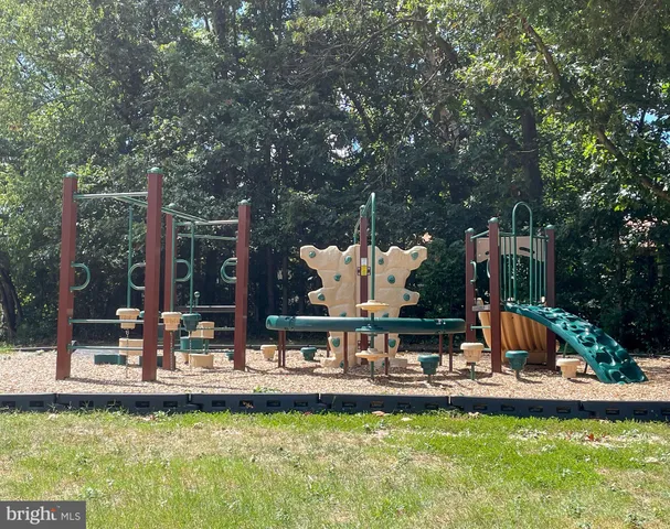 a view of a swimming pool with a yard