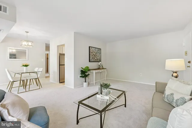 a front view of a house with a yard table and chairs