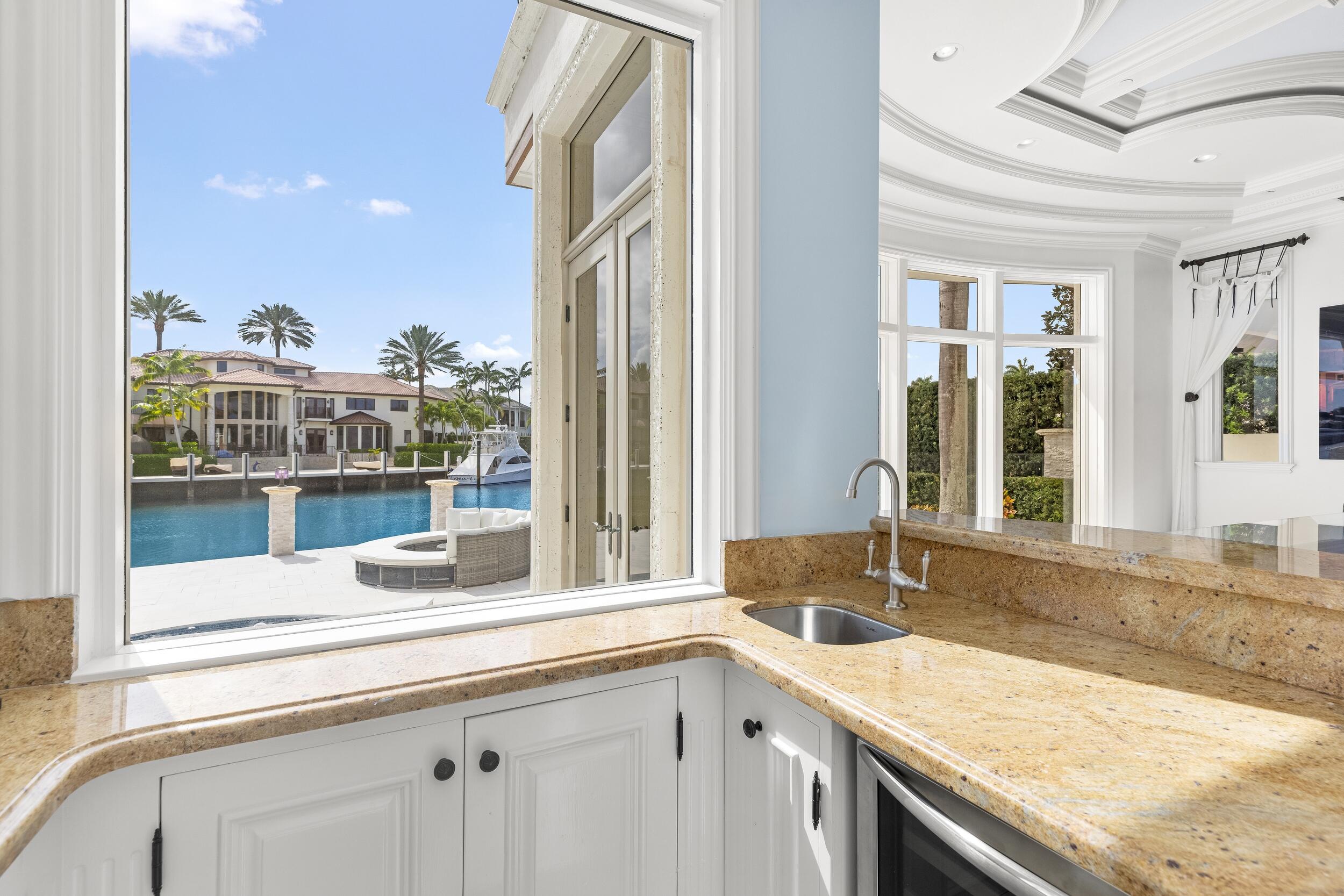 3201 Northeast 27th Avenue Lighthouse Point, FL 33064 - Photo 22 of 66 a view of a kitchen with a sink and large window