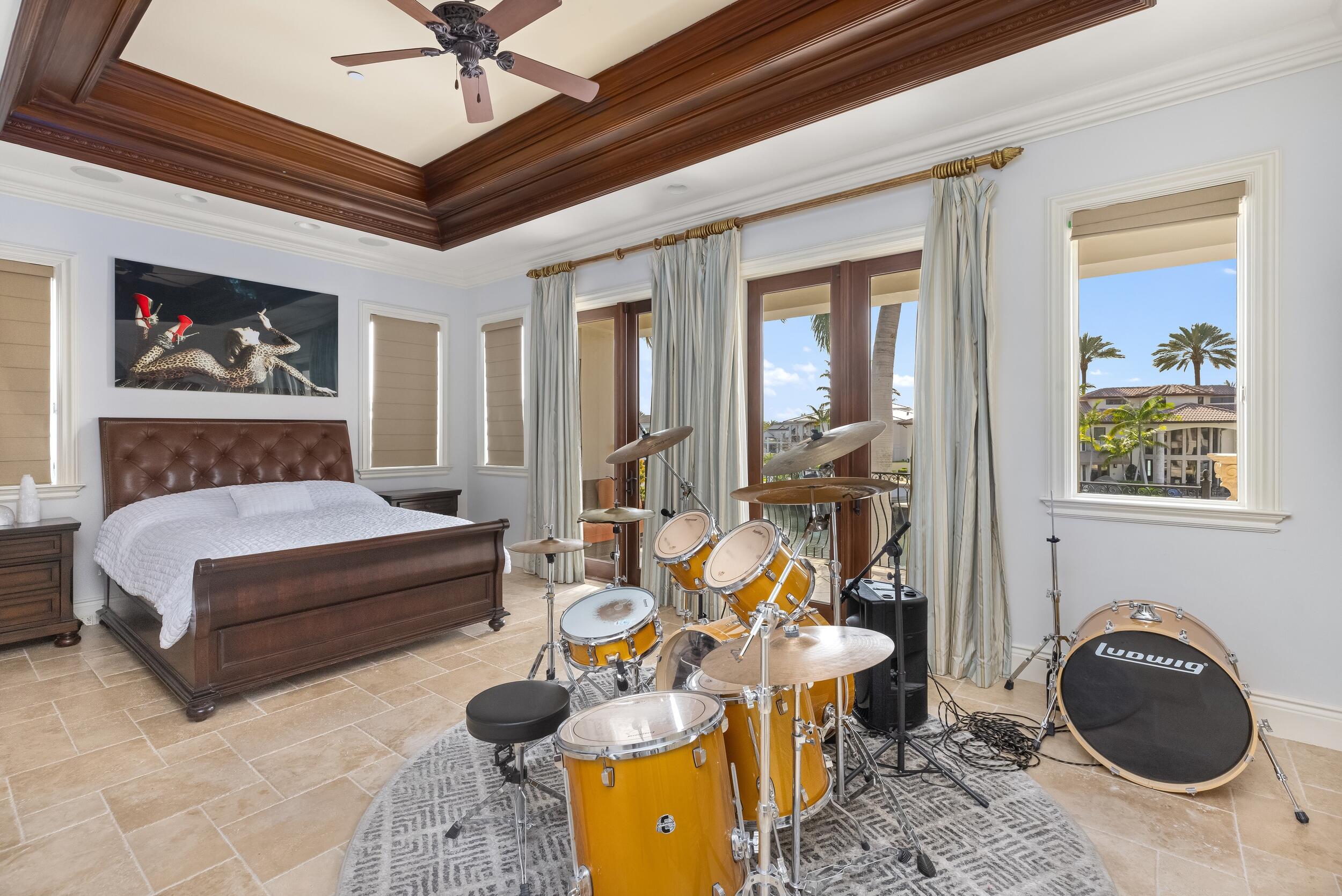 3201 Northeast 27th Avenue Lighthouse Point, FL 33064 - Photo 44 of 66 a bedroom with furniture and a large window