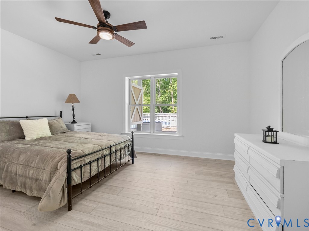 6126 Autumn Bluff Road Powhatan, VA 23139 - Photo 39 of 47 a bedroom with a bed and a dresser
