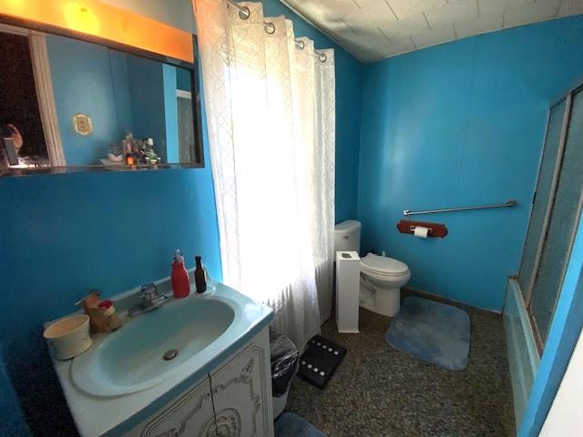 842 Chestnut Street Emmaus, PA 18049 - Photo 6 of 13 A vibrant bathroom features a single vanity, reflecting light from a bright window.