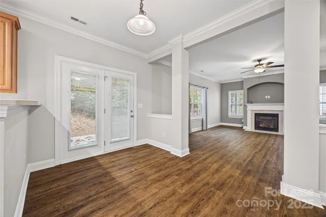 a view of livingroom with hardwood floor and a fireplace