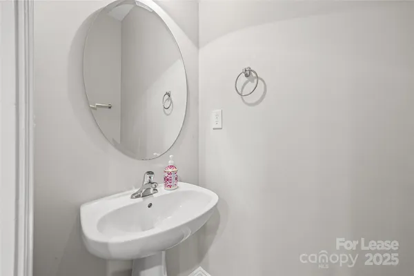 a bathroom with a sink and mirror